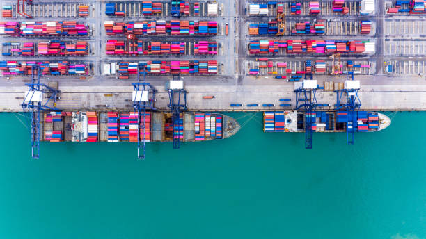 istock Aerial top view container ship at terminal seaport, Global business cargo freight ship import export logistic and transportation by container vessel ship company worldwide. 1276570870