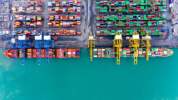 istock Aerial top view container ship at terminal seaport, Global business cargo freight ship import export logistic and transportation by container vessel ship company worldwide. 1276570875