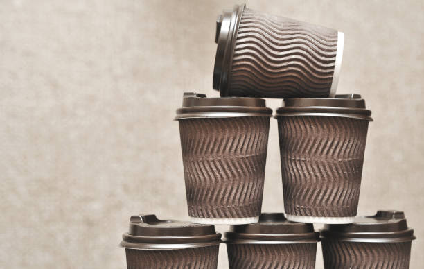 istock Brown paper cups for coffee on wooden background. 1276571566