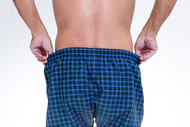 istock Asian man wearing blue boxer underwear 1276571699