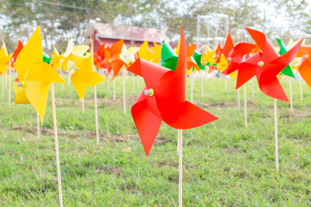 istock Toy wind turbine in the garden 1276572565