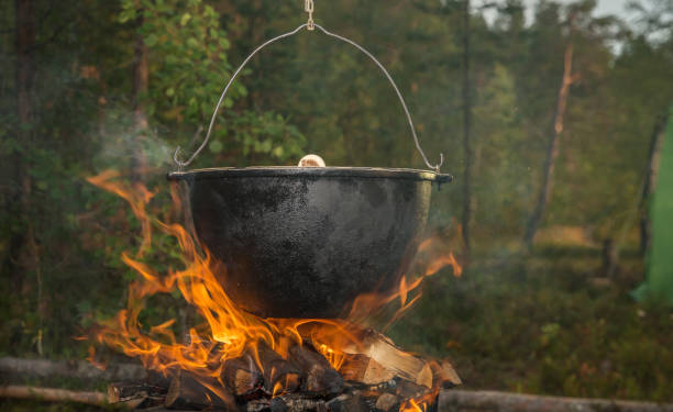 Kettle over campfire. Cooking on a fire. cauldron photos stock pictures, royalty-free photos & images