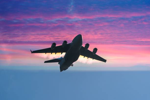 istock Military aeroplane in flight with incredible sunset 1276572980