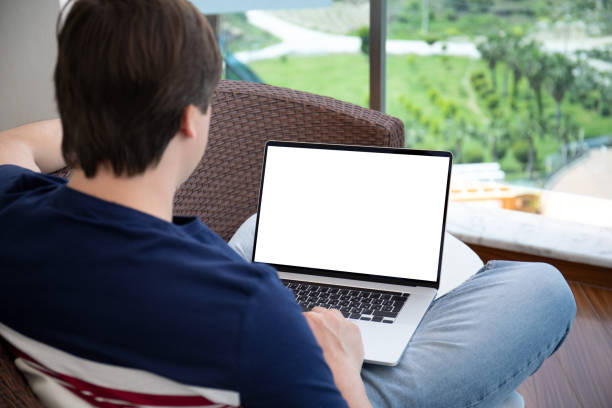 istock man working on laptop with isolated screen at home 1276573067