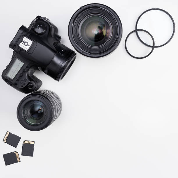 istock photography concept - photo equipment and copy space over white table 1276573952