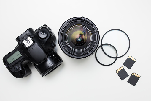 modern photography equipment over white table background