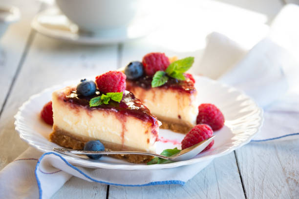 istock Homemade delicious cheesecake with fresh fruit and mint 1276578962