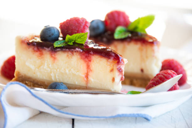 istock Homemade delicious cheesecake with fresh fruit and mint 1276578985
