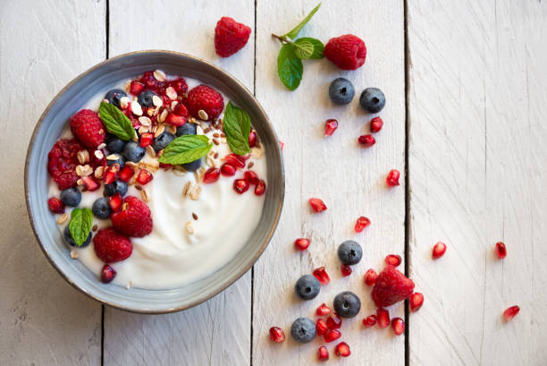 istock Yogurt with fresh fruit and cereals in a bowl, healthy breakfast 1276579073
