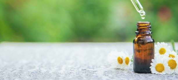 istock Chamomile essential oil in a small bottle. Selective focus. 1276579479