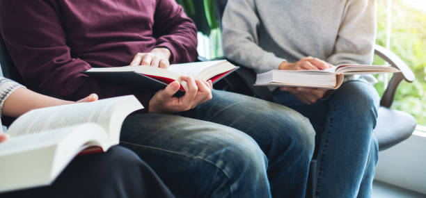 istock Group of young people enjoyed reading books together 1276580210