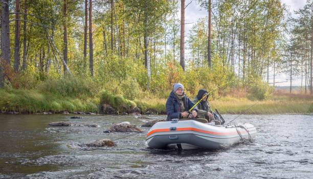 istock Two men in a boat fishing. 1276580645