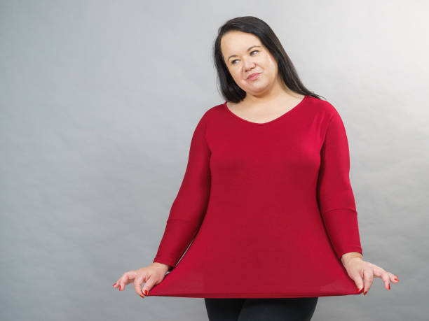 istock Woman plus size in red tunic 1276580703