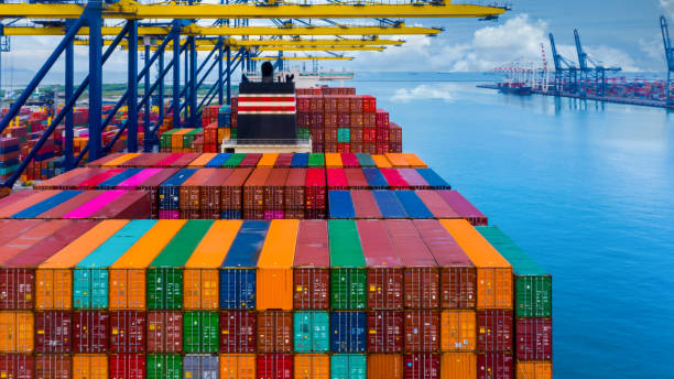 Aerial view container ship at deep terminal seaport, Global business cargo freight ship import export shipping logistic and transportation by container vessel ship company worldwide.