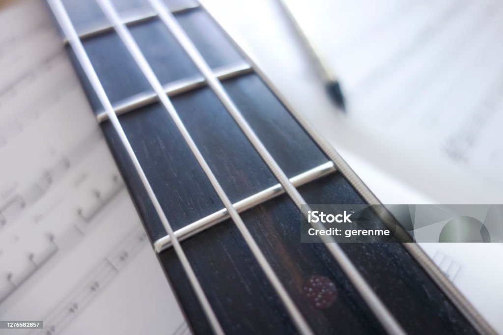 Bass guitar Writing music on bass guitar Bass Guitar Stock Photo