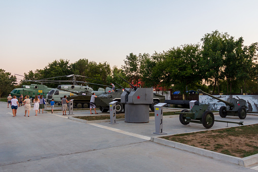 Anapa, Russia - August 11, 2019: tourists walk at the exhibition of military equipment in Anapa