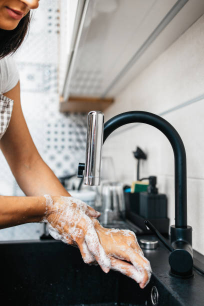 istock Woman washing hands 1276587643