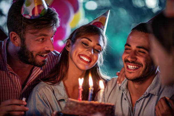 group of friends celebrating birthday party outdoors. - birthday party adult women imagens e fotografias de stock