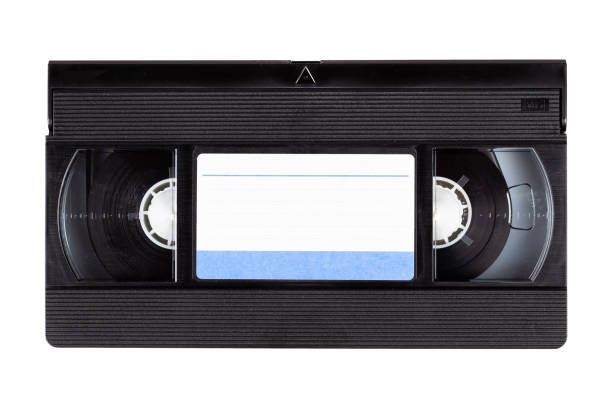 Old black vintage vhs cassette tape front with a blank paper label, front side, top view isolated on white, cut out 80s, 90s retro media aesthetic, magnetic videotape movie storage concept, studio shot Vintage vhs cassette tape front with a blank paper label, front side, top view isolated on white, cut out 80s, 90s retro media aesthetic, magnetic videotape movie storage concept studio shot audio cassette blank vcr film reel stock pictures, royalty-free photos & images