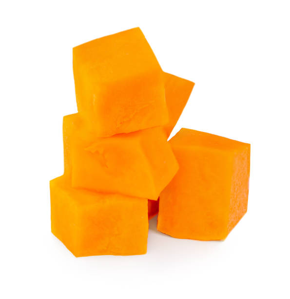 istock Fresh orange pumpkin pieces  isolated on white background. 