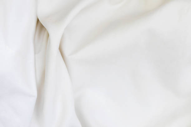 istock Close up of white bedding sheets soft focus and copy space 1276592662
