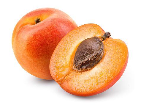 Apricots. Apricot isolate. Apricots with slice on white. Fresh apricots. With clipping path. Full depth of field.
