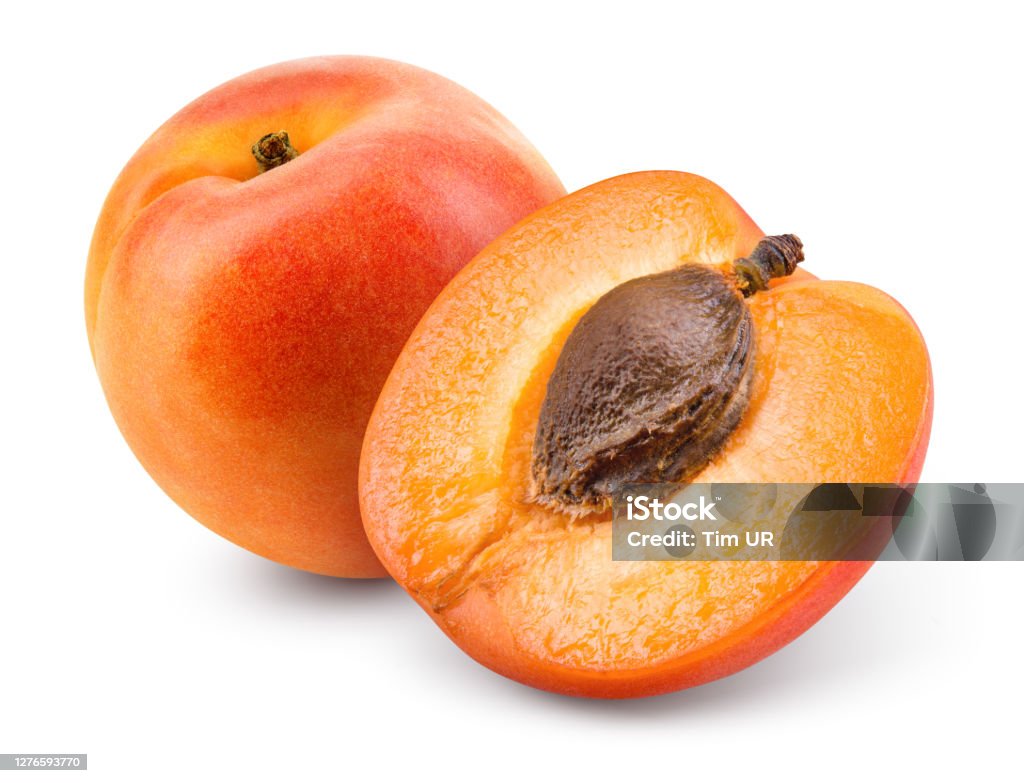 Apricots. Apricot isolate. Apricots with slice on white. Fresh apricots. With clipping path. Full depth of field. Apricot Stock Photo