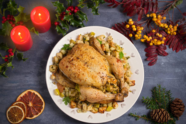 istock Roasted chicken stuffed with apple bread and celery. Christmas Thanksgiving dinner 1276596048