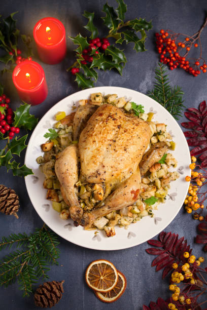 istock Roasted chicken stuffed with apple bread and celery. Christmas Thanksgiving dinner 1276596056