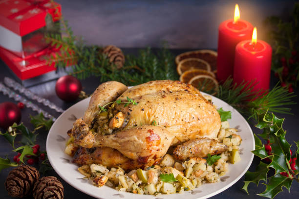 istock Roasted chicken stuffed with apple bread and celery. Christmas Thanksgiving dinner 1276596098