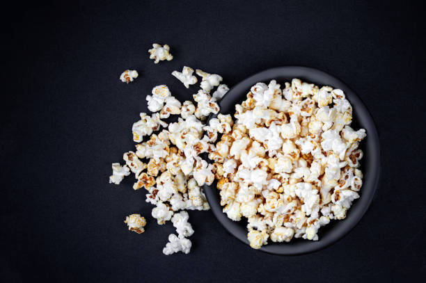 istock Homemade Kettle Corn Popcorn on black background with copy space. Top view