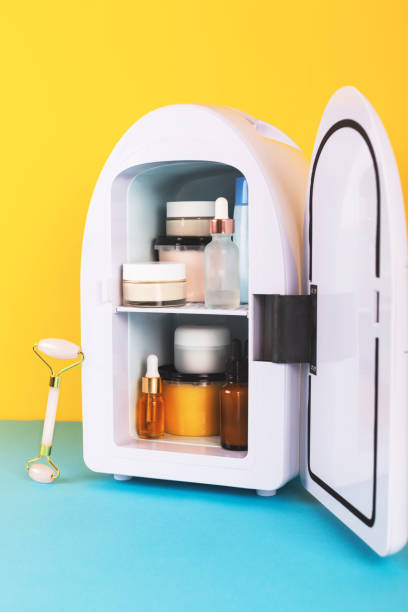 istock Mini fridge on yellow and blue background. Minimal composition. 1276598161
