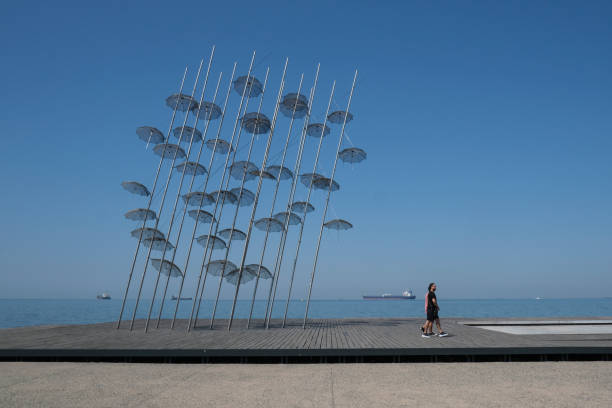 The sculpture Umbrellas by George Zongolopoulos are located at the New Beach in Thessaloniki, Greece on July 29, 2020