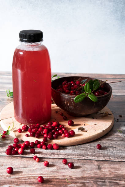 istock Cranberries and cranberry juice in a plastic bottle 1276602658