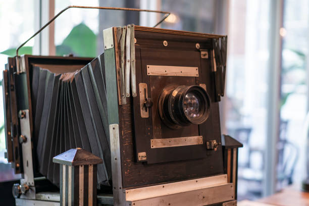 istock Vintage, antique large format camera in blurred background. 1276604350