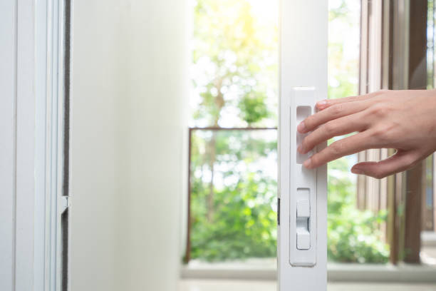 istock Close up hand opening plastic vinyl glass door. 1276604500