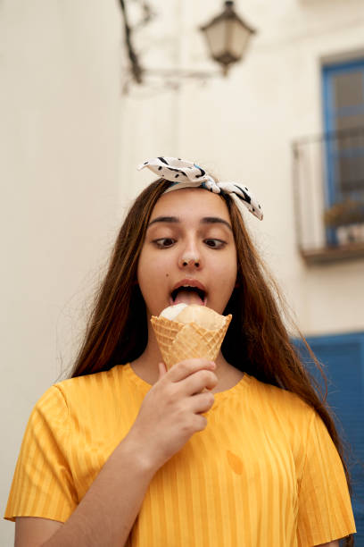 Girl eating ice cream outdoors