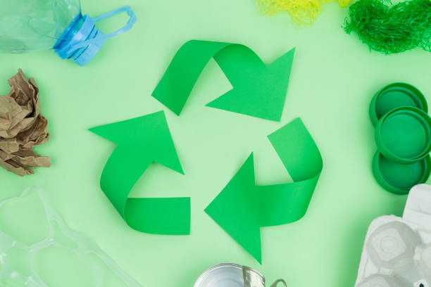 istock Green recycling logo with objects to recycle. Recycling concept.t. 1276606117