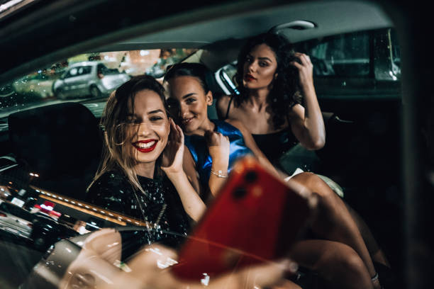 istock Girls are having fun in the cab 1276607375
