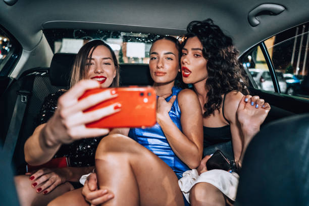 istock Girls are having fun in the cab 1276607437