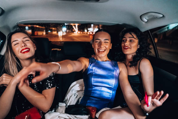 istock Girls are having fun in the cab 1276607468