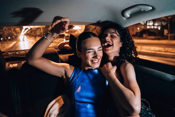 istock Girls are having fun in the cab 1276607518