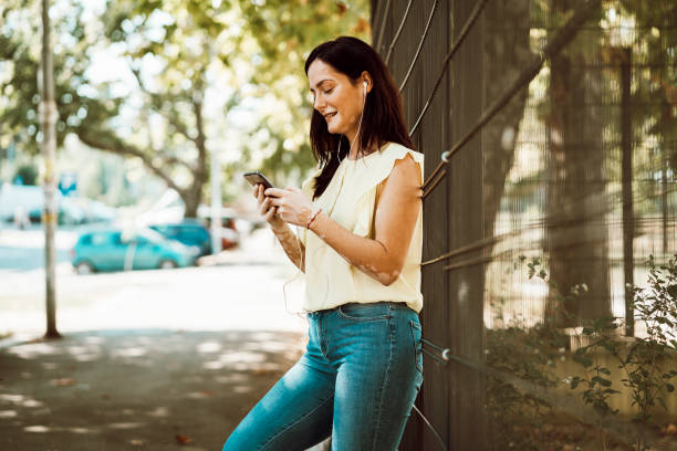 istock Beautiful young girl with skin problems using phone, enjoy in life 1276609787