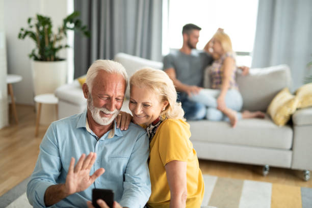 istock Happy seniors using phone for a video call. 1276610465