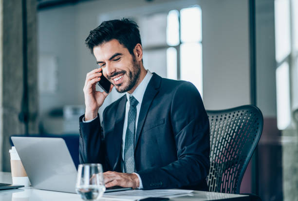 istock Businessman in office talking on phone. 1276611224