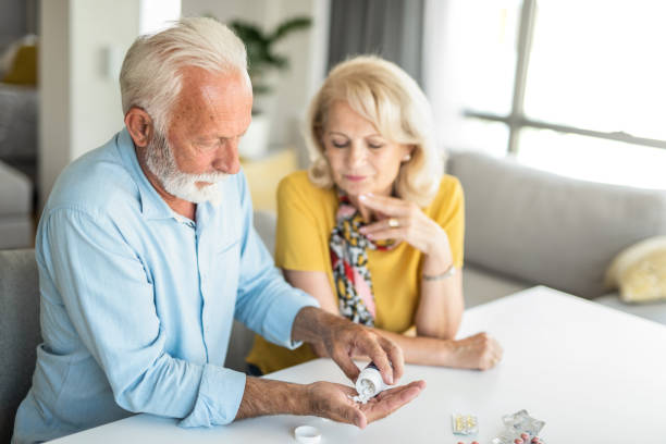 istock Frustrated senior man taking prescription medicine. 1276611234