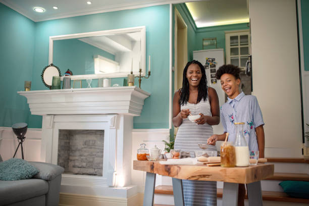 istock Mom with daughter on kitchen 1276613358