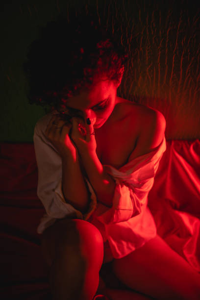 istock Sad lonely woman in bed 1276614590