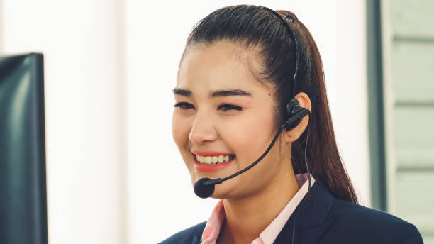 istock Business people wearing headset working in office 1276614986