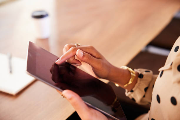 istock Businesswoman sitting at a table using a digital tablet 1276615312